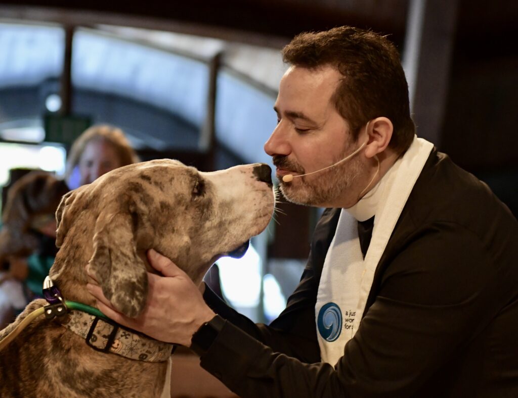 Pastor Sal blessing a Great Dane